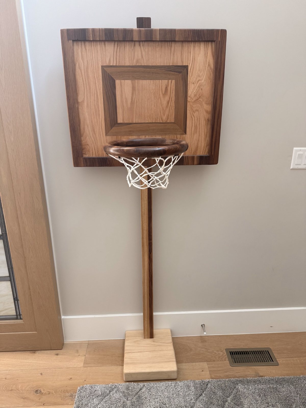 Close-up of a custom Hardwood Heirlooms basketball standard